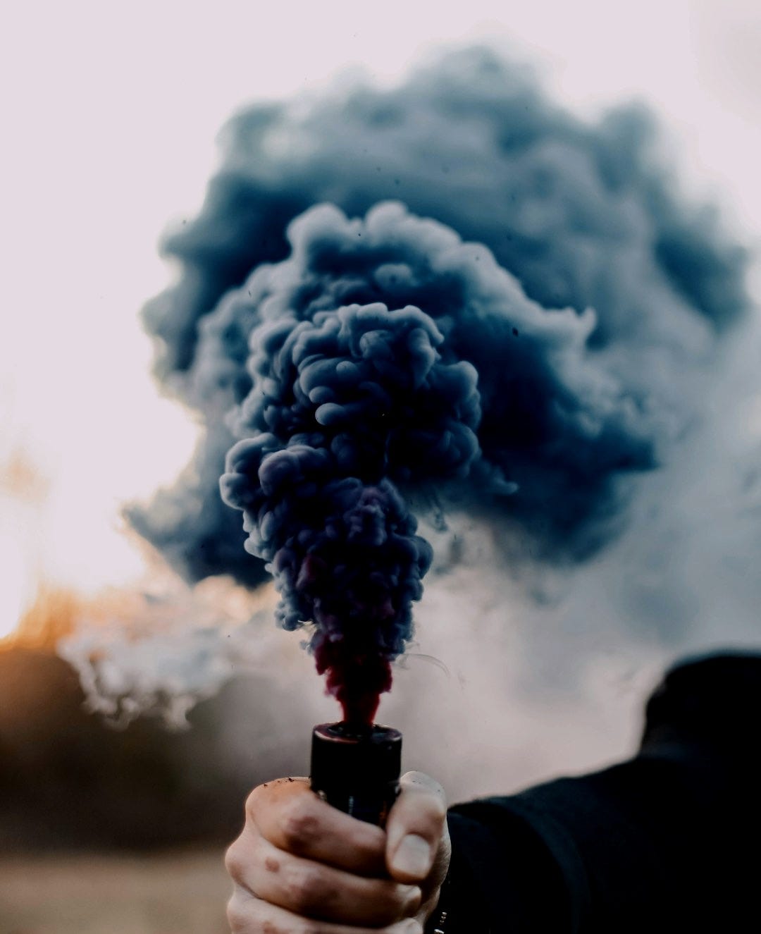 white smoke on black clouds white smoke on black clouds