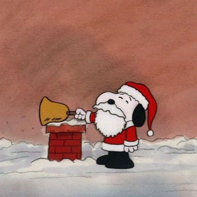 This may contain: a cartoon character with a bell in his hand and a brick wall behind him that has snow on it