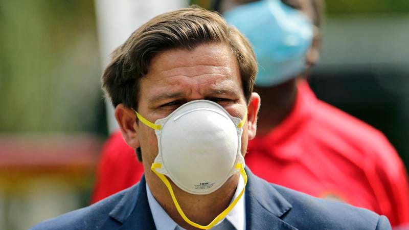Florida Gov. Ron DeSantis wears a protective mask during a recent press conference.