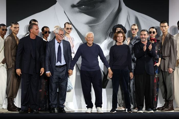 Giorgio and Roberta Armani with the Emporio Armani fashion show team.