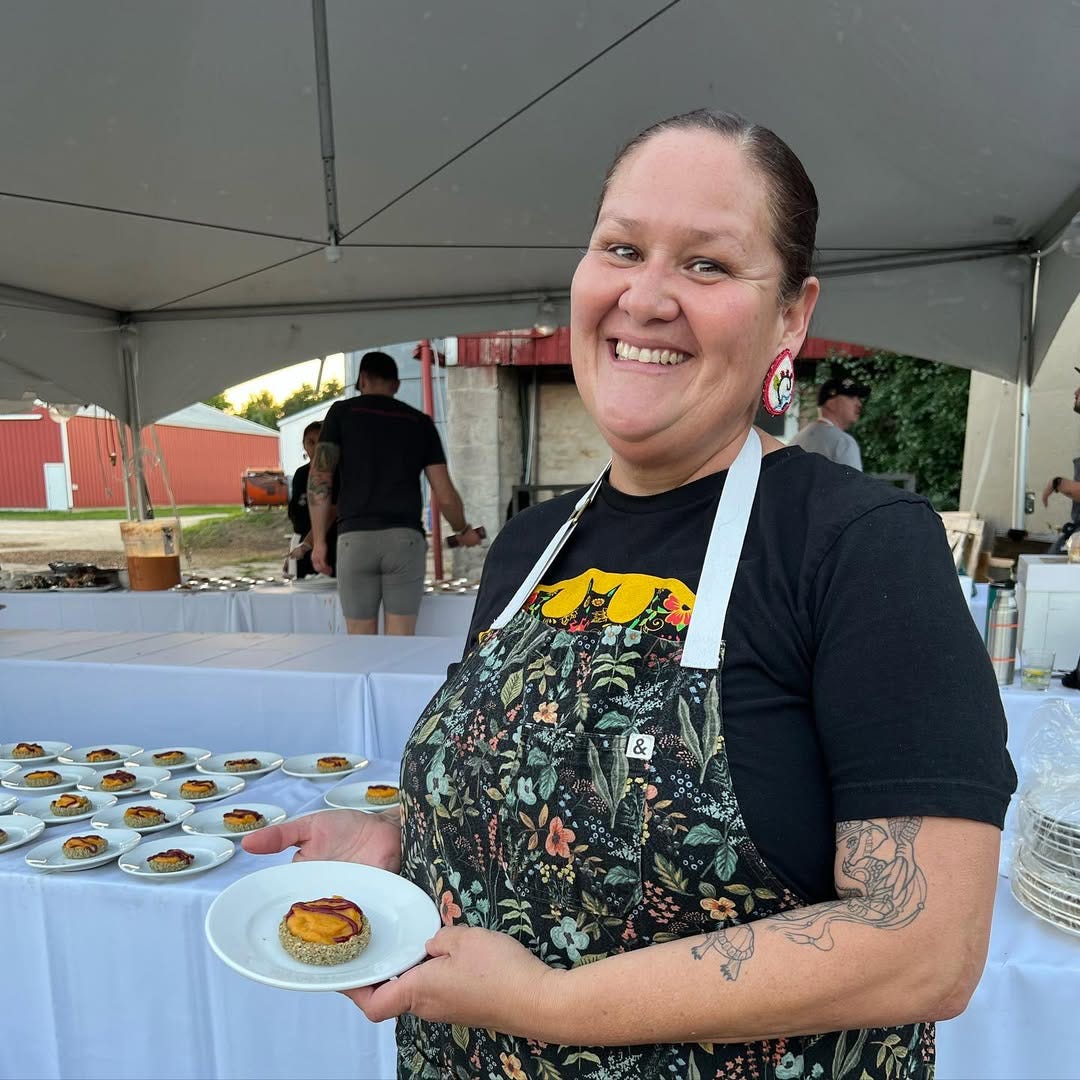 Chef Elena Terry before catering buffet table