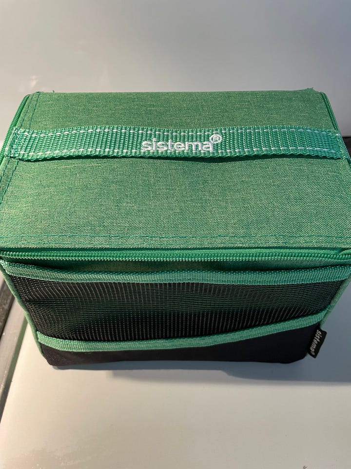A green insulated lunch bag contains a freshly fed sourdough starter, 107 year old organic rye sourdough starter, sourdough bread, dehydrated starter, Australian flour, bake sourdough at home, RNR Sourdough, Rock n Roll Sourdough