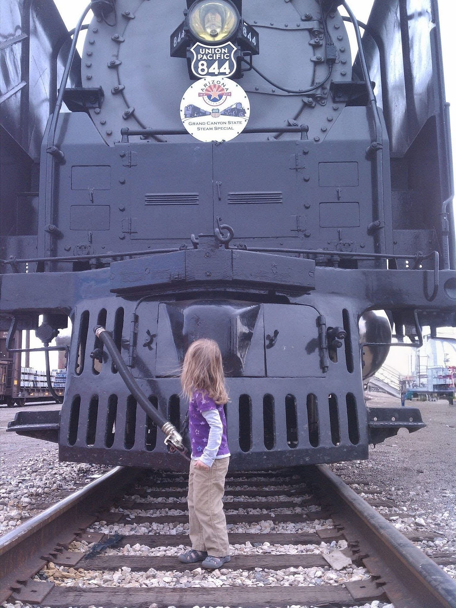 “Not Thomas”, photograph by Douglas Meredith. An image of a very large steam locomotive (Union Pacific 844) and a very small child.