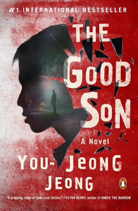 The cover of The Good Son features a minimalistic yet eerie design. A bold red background dominates, with a faint silhouette of a young man’s face partially obscured by shadows, reflecting the protagonist's hidden truths. The title appears in large, white capital letters near the top, with the author's name in smaller text below. Splashes of dark red or black subtly evoke blood, adding a sinister undertone.