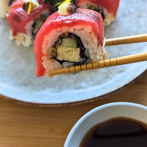 Three dishes finished with ponzu: tofu and seared tomato sushi, chilled hiyayakko with furikake, and tomato “tuna” sashimi — each showcasing ponzu’s bright, savory balance.
