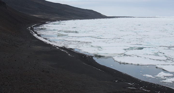 Two images showing beaches of dark stones, sea with ice and a grey sky, as described in opening paragraph