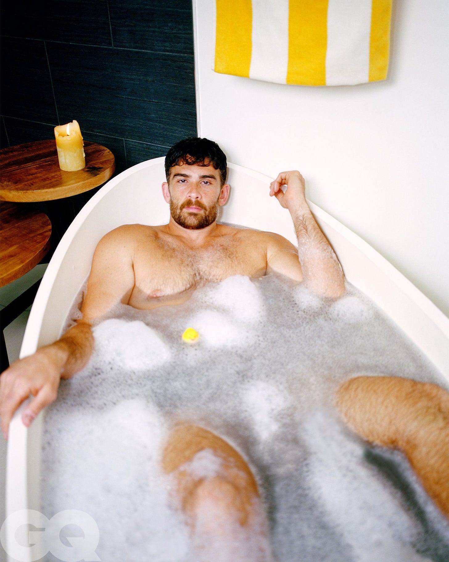 Image may contain Bathing Bathtub Person Tub Adult and Candle Image may contain Bathing Bathtub Person Tub Adult and Candle