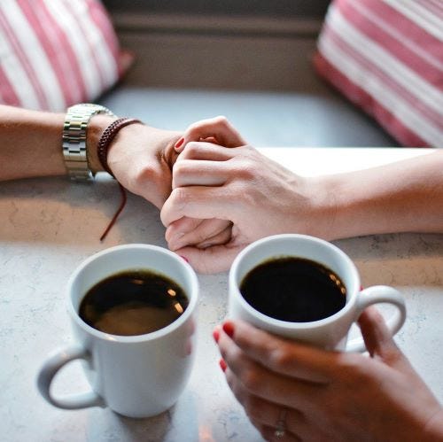 Couple holding hands.