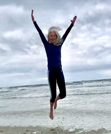 A person jumping in the air on a beach

AI-generated content may be incorrect.