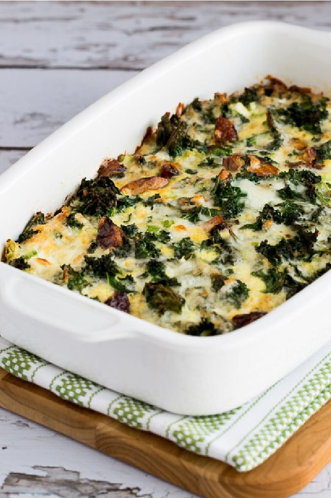 Close-up of Sausage, Kale, and Mozzarella Egg Bake shown in baking dish Close-up of Sausage, Kale, and Mozzarella Egg Bake shown in baking dish