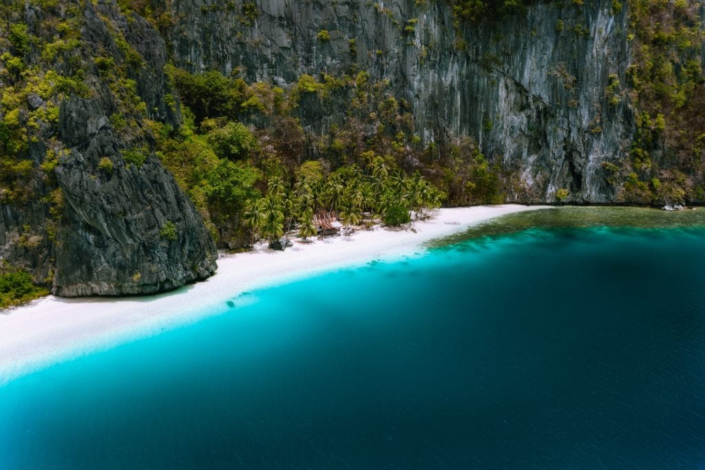 El Nido, Palawan, Philippines. Aerial drone view of solitude tropical hut on Pinagbuyutan Island El Nido, Palawan, Philippines. Aerial drone view of solitude tropical hut on Pinagbuyutan Island