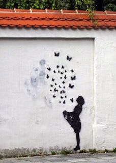 A Bansky (I think) mural of a girl holding up her dress, releasing a flock of butterflies.