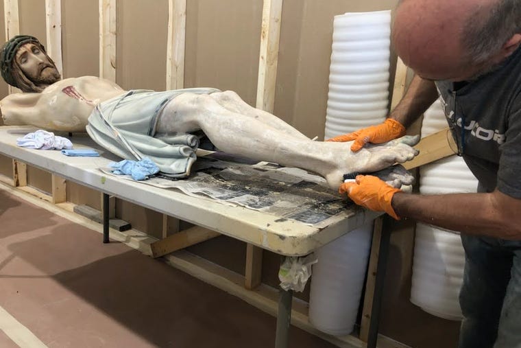 Robert Elliot, an artisan and owner of his own studio in Kansas, restores the crucifix, the Stations of the Cross and other statues damaged during a fire at Mary, Queen of Angels parish in Fort Scott, Kansas, Aug. 29, 2022. Robert Elliot, an artisan and owner of his own studio in Kansas, restores the crucifix, the Stations of the Cross and other statues damaged during a fire at Mary, Queen of Angels parish in Fort Scott, Kansas, Aug. 29, 2022.