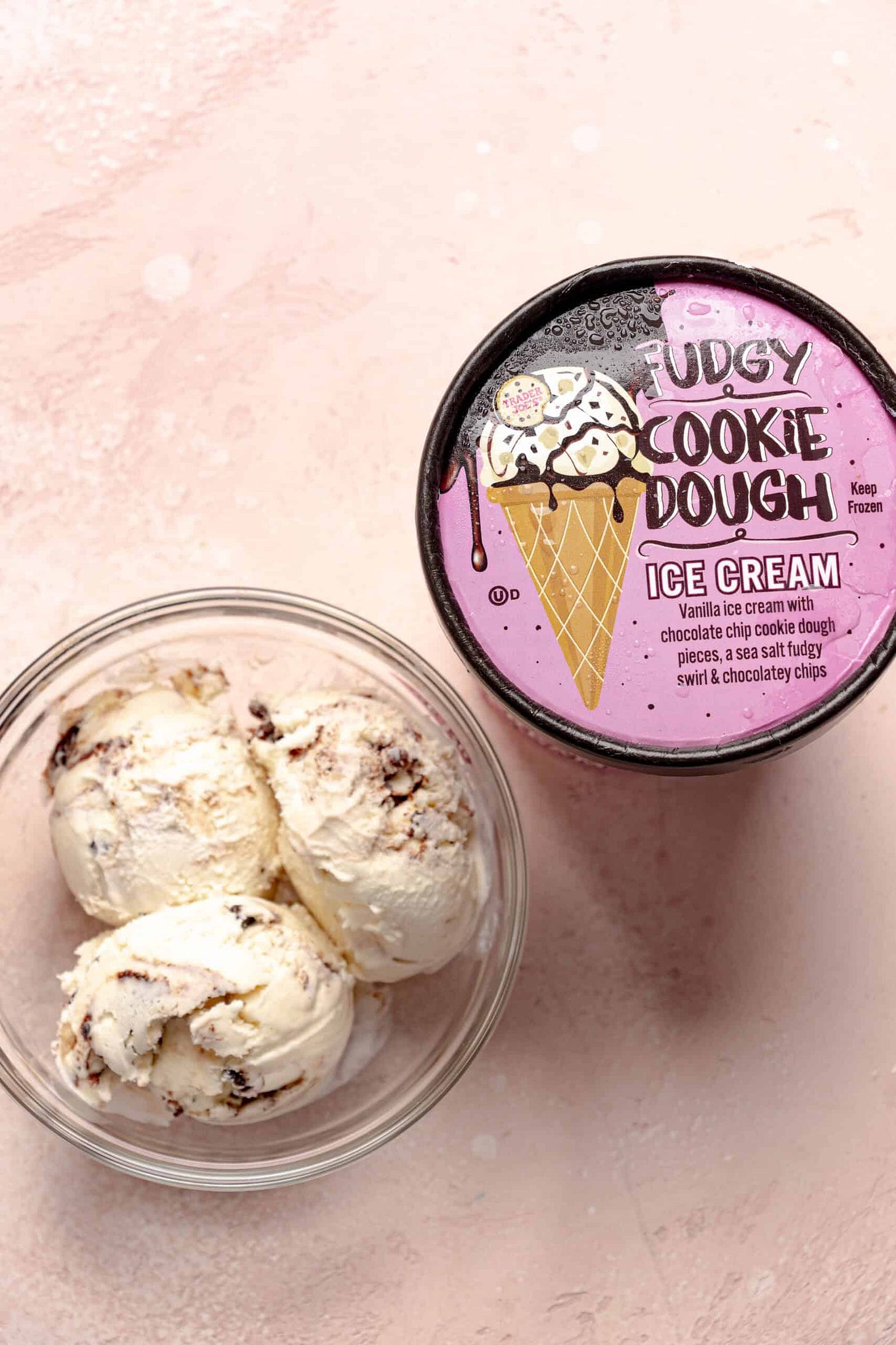 Trader Joe's Fudgy Cookie Dough Ice Cream in a bowl next to the original container.