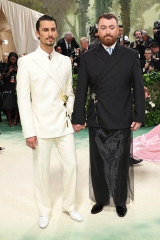 Image may contain Sam Smith Blazer Clothing Coat Jacket Formal Wear Suit Adult Person Accessories Bag and Handbag
