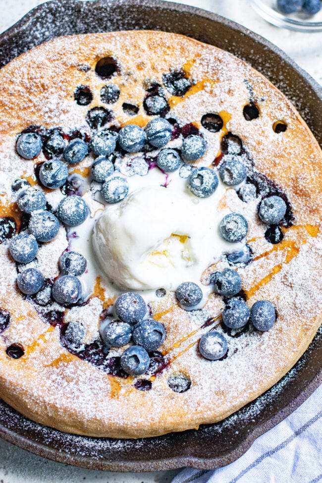 Pumpkin Blueberry Dutch Baby Pancake topped with vanilla ice cream. Pumpkin Blueberry Dutch Baby Pancake topped with vanilla ice cream.