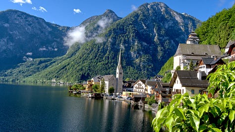 The series of images showcasing the beauty of Hallstatt in Austria from dawn to dusk.