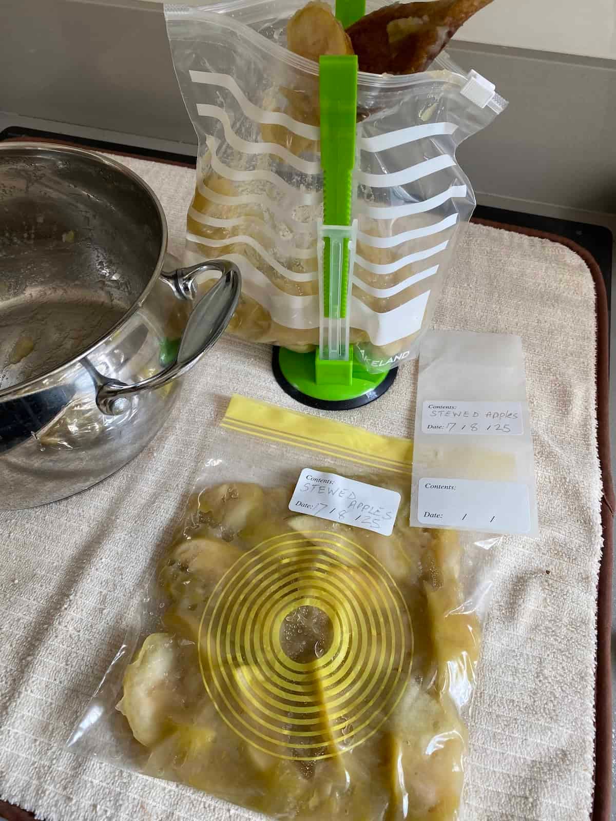 Vacuum-sealed frozen food in a freezer drawer for long-term storage.