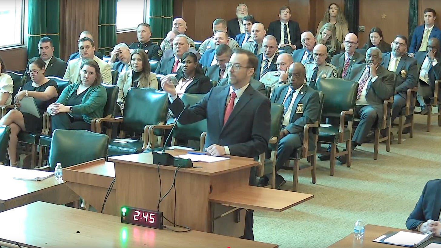 Lawyer holding up a baggie of cannabis in courtroom. Lawyer holding up a baggie of cannabis in courtroom.