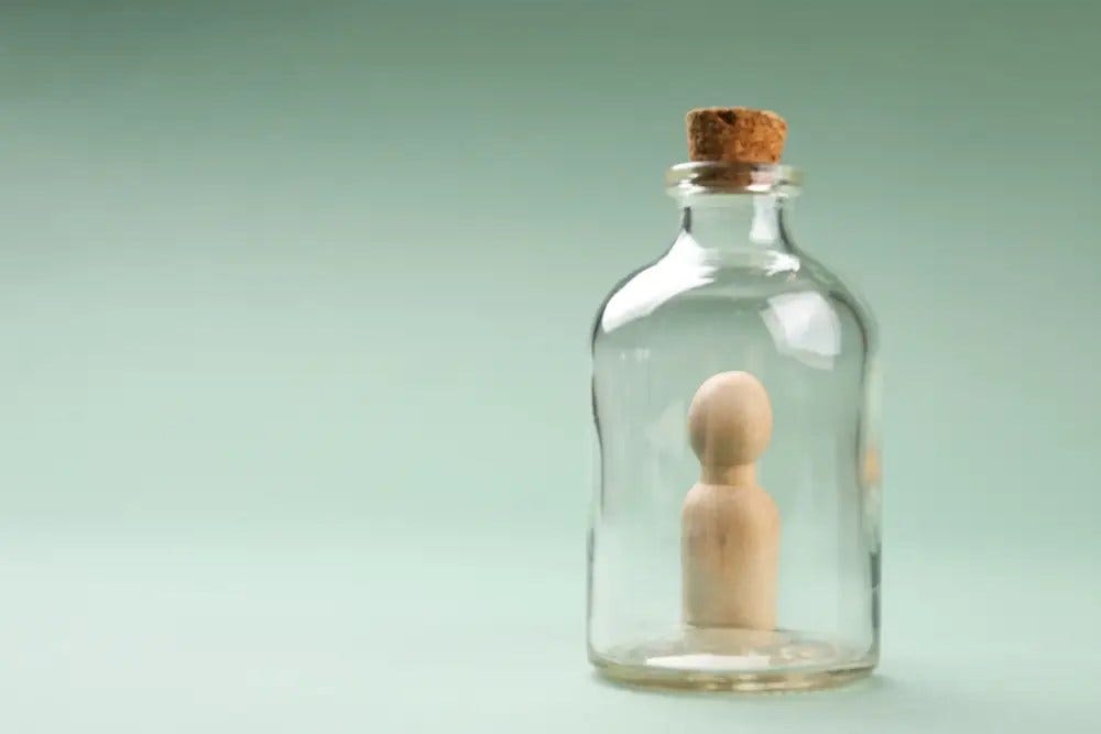 Loneliness concept. Stuck in a bottle. Existential loneliness in neurodivergent individuals. Neurodiversity. Autism. ADHD.