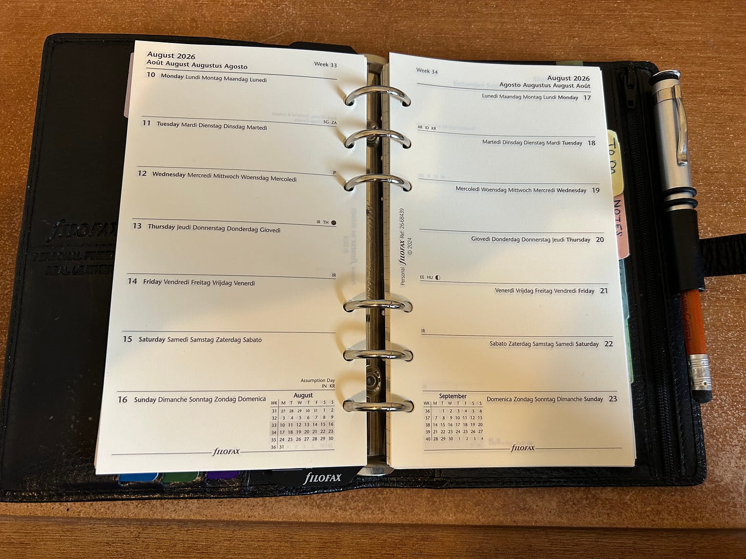 A Filiofax Personal size organiser opened in the diary pages for August 2026. This is owned by the author, Roland Millward. The organiser is open on a desk. Image: Roland Millward