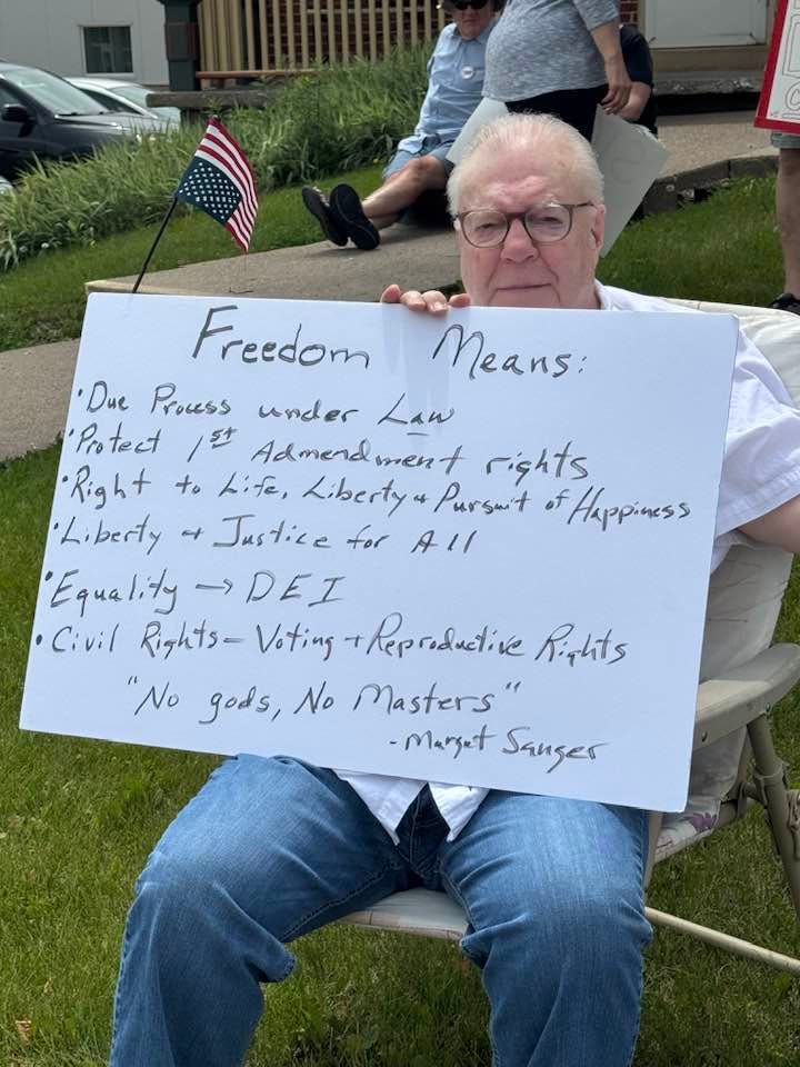 May be an image of 2 people and text that says 'Freedom eaиR: 'Due Process under Law Protect /5 Admend ment rights Right to Life, Liberty. Pursu't Happiness Liberty →Justice for All Equality →DEI Civil Rights- Voting +Repraductive Righits "No gods, No Masters" -Margat Sanger'