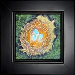 Small silk painting showing a bird's nest containing three small eggs