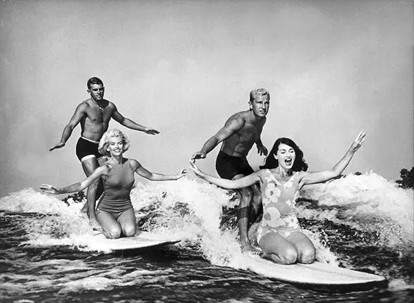 Water ski champions demonstrating skills, riding wave wakes without a tow-line at Cypress Gardens, Florida, 1965. Water ski champions demonstrating skills, riding wave wakes without a tow-line at Cypress Gardens, Florida, 1965.