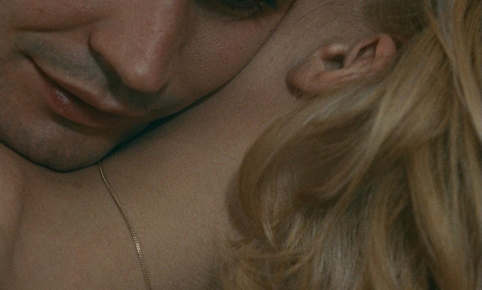 man resting face on woman's bare neck man resting face on woman's bare neck