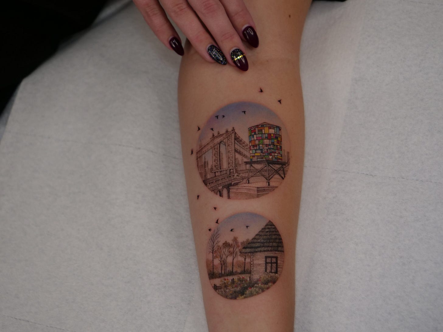 a person's arm with a tattoo on it