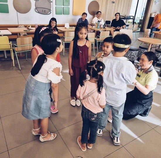 The children participating in games at McDonald's