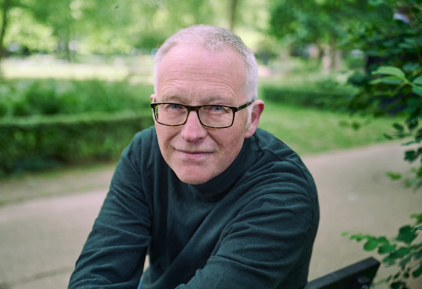 Photo of Tim Relf, wearing glasses and smiling