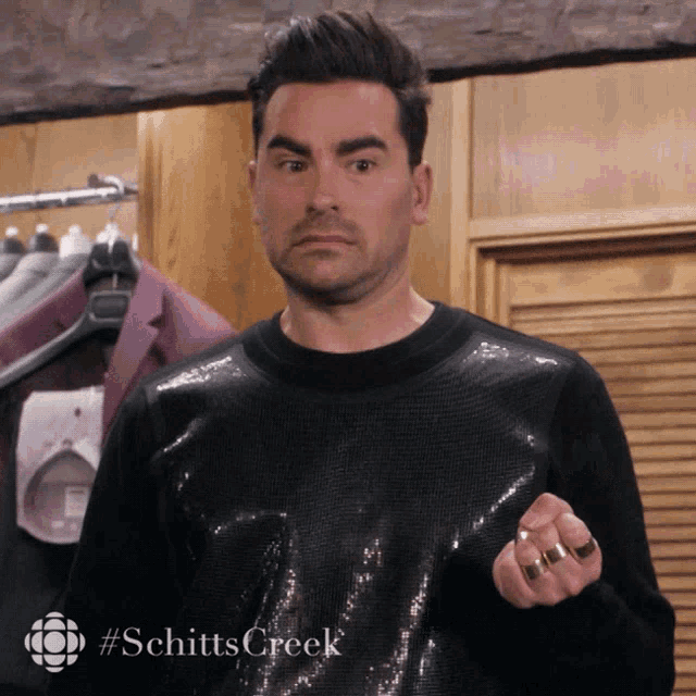 David from Schitt's creek looks disturbed while wearing a sequinned jumper