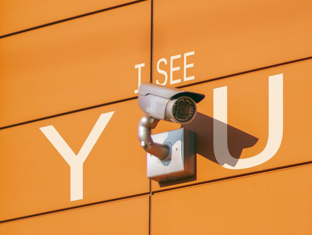 a security camera mounted to the side of a building