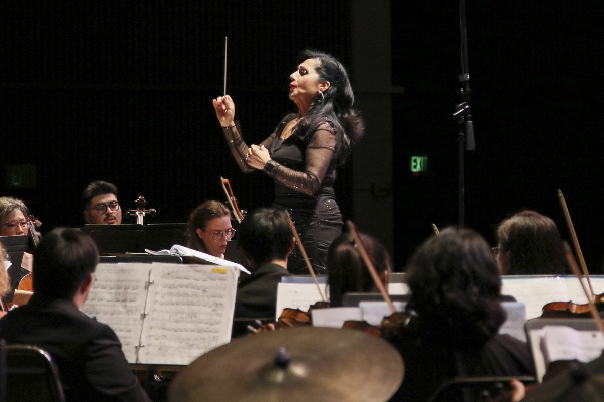 El Camino College professor Joanna Nachef conducts the ECC Symphony Orchestra and Choir at the Marsee Auditorium on Saturday, May 31. The concert, titled "A Legacy of Excellence - 30th Anniversary Concert" is in honor of Nachef as she is set to retire from ECC by the end of this semester marking the end to a 30-year-long career as a dedicated educator. (Mario Trejos | The Union) El Camino College professor Joanna Nachef conducts the ECC Symphony Orchestra and Choir at the Marsee Auditorium on Saturday, May 31. The concert, titled "A Legacy of Excellence - 30th Anniversary Concert" is in honor of Nachef as she is set to retire from ECC by the end of this semester marking the end to a 30-year-long career as a dedicated educator. (Mario Trejos | The Union)