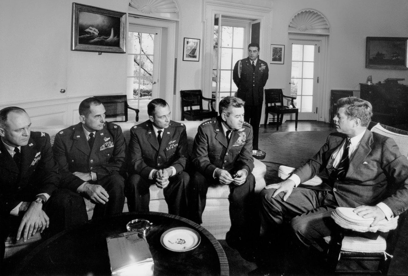 President Kennedy met with General LeMay and others during the 1962 Cuban Missile Crisis to discuss results of surveillance missions in Cuba. Source: Smithsonian Magazine President Kennedy met with General LeMay and others during the 1962 Cuban Missile Crisis to discuss results of surveillance missions in Cuba. Source: Smithsonian Magazine