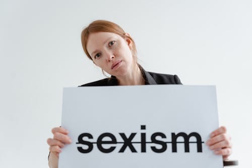Free Woman in Black Blazer Holding White Paper Stock Photo