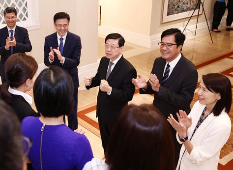 John Lee Ka-chiu and other Hong Kong officials meet the city's taikonaut candidates in June 2023.