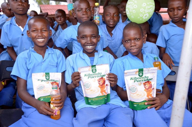 A group of children with Burundi Fortified Foods' products.