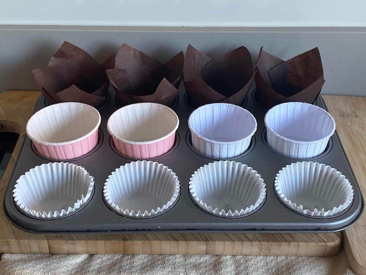Muffin cases in a muffin tin. Muffin cases in a muffin tin.