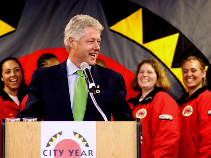 President George H.W. Bush was a decorated veteran who promoted Points of Light | President Bill Clinton accepts City Year Legacy Award.
