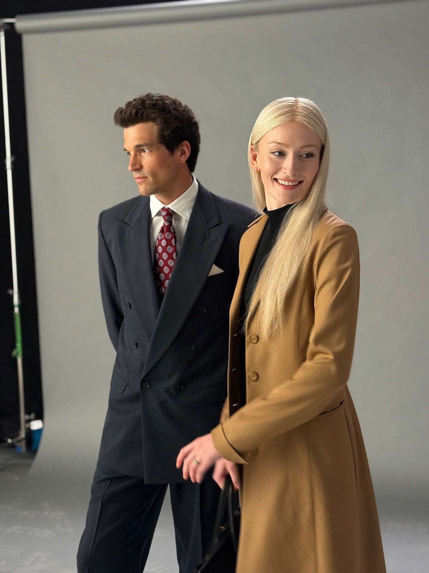 Image may contain Frank John Hughes Adult Person Clothing Coat Blazer Jacket Formal Wear Suit Accessories and Bag