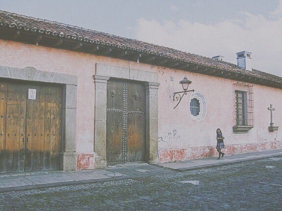 4 photos of Antigua, climbing a volcano outside the city and visiting Chichicastenango.