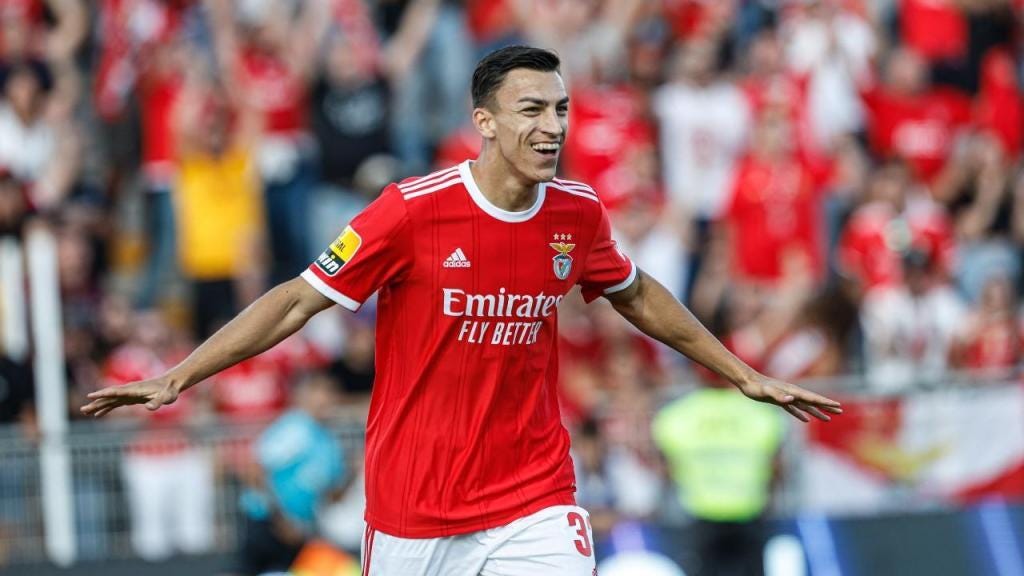 A person in a red jersey

Description automatically generated