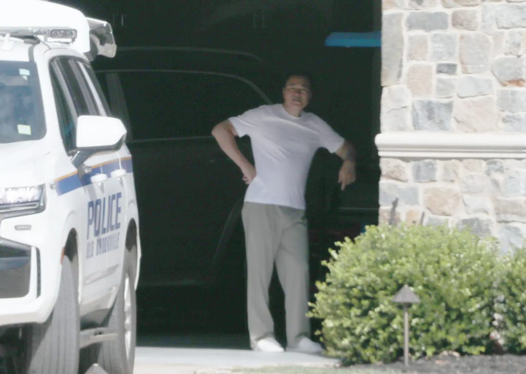 Zhu watches his Nassau County home get raided.