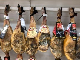 hung pork legs with tags on them hung pork legs with tags on them