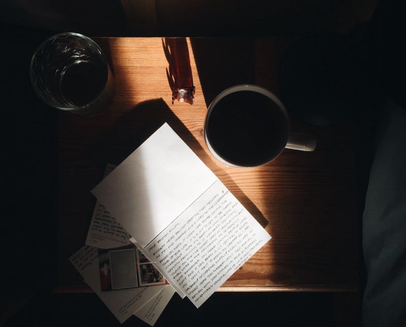 A diary with some notes and a coffee mug A diary with some notes and a coffee mug