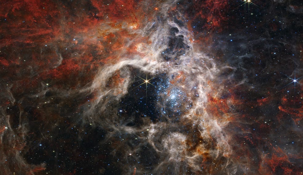 Swirling reds, whites, and light yellows mix around in front of a starry sky. Swirling reds, whites, and light yellows mix around in front of a starry sky.