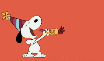 Snoopy blowing a noise maker to ring in the new year.