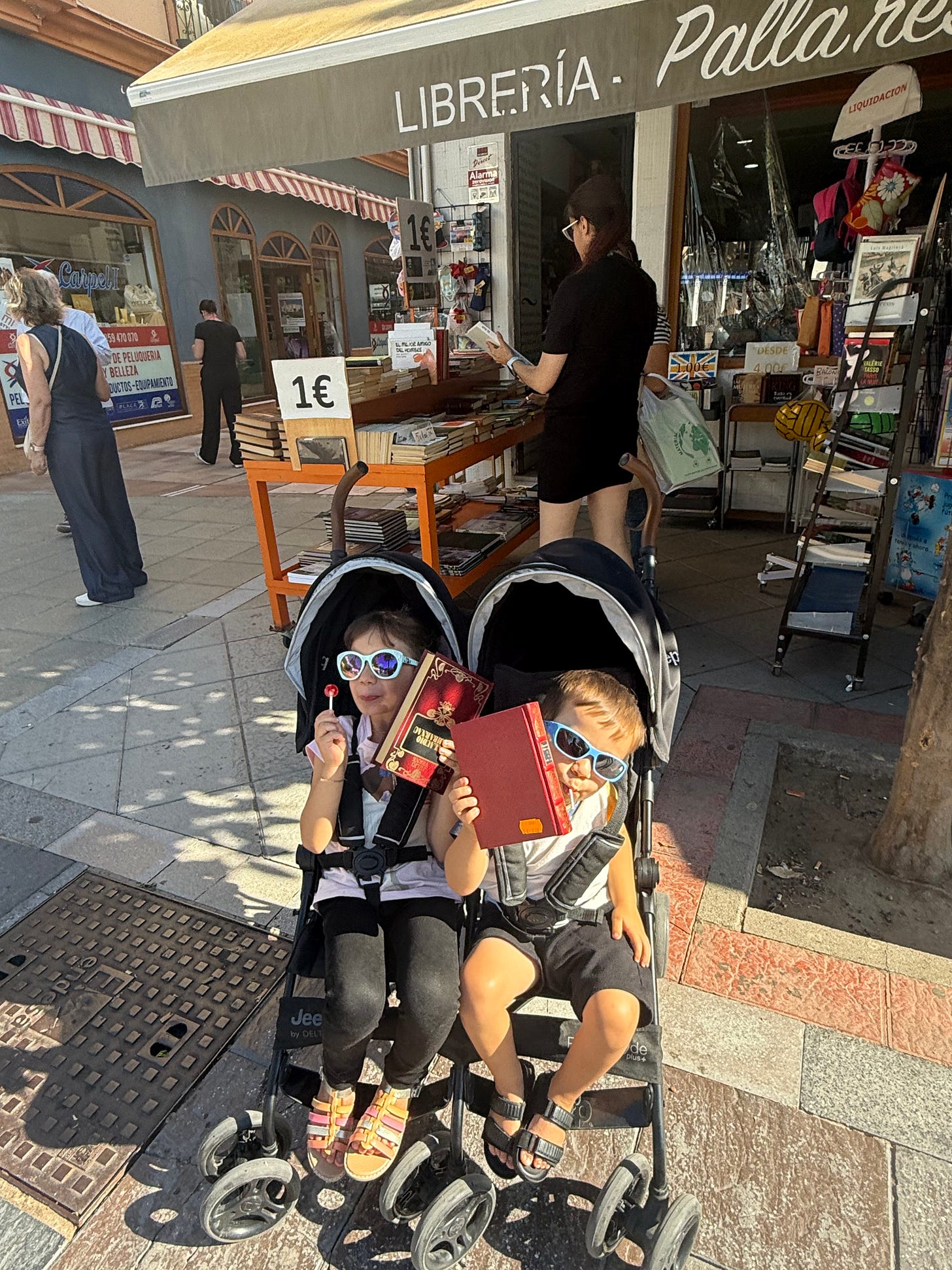 Local bookstore with kids holding copies the author purchased